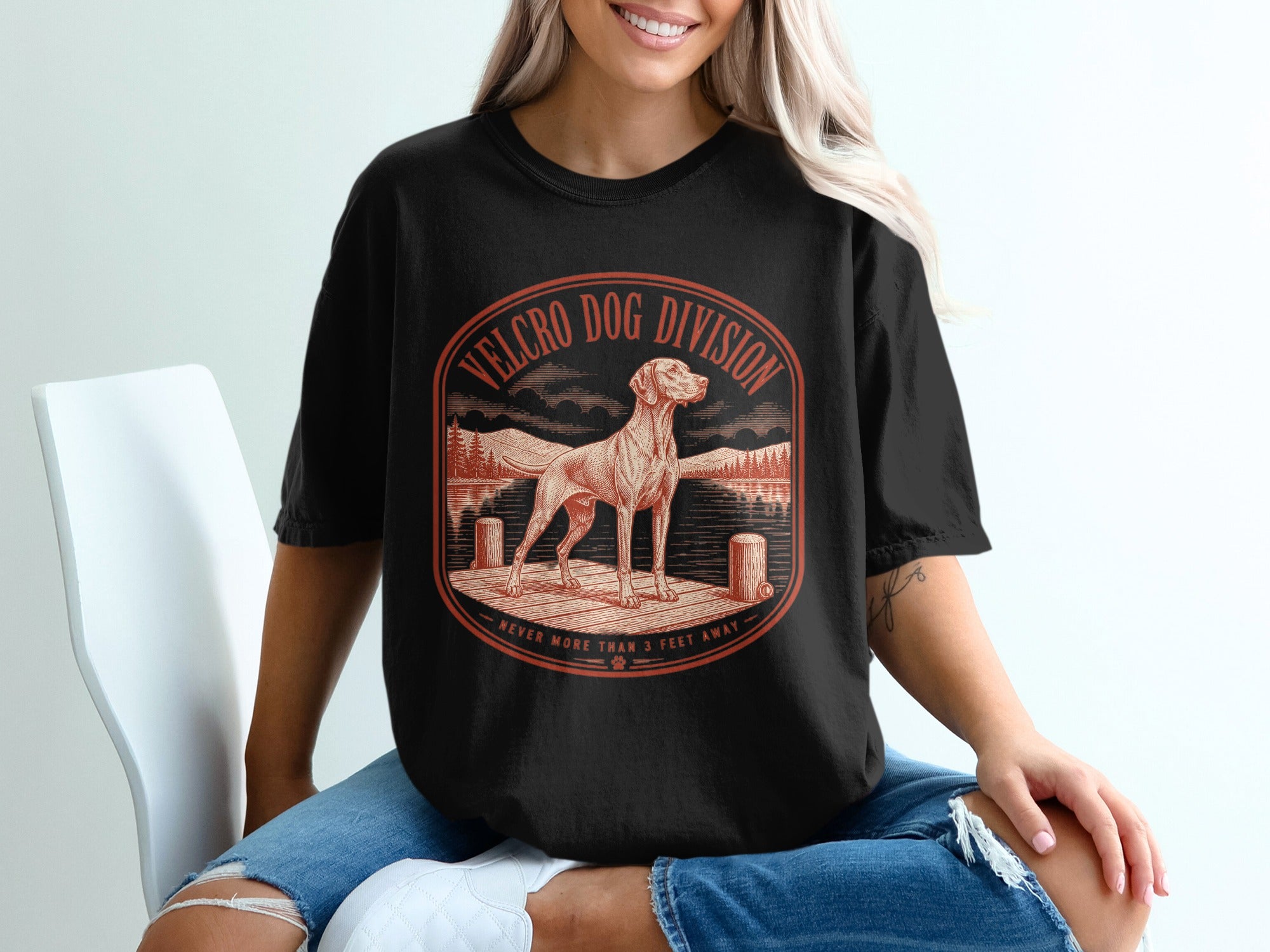 Black t-shirt with "Velcro Dog Division Never More Than 3 Feet Away" text and dog graphic.