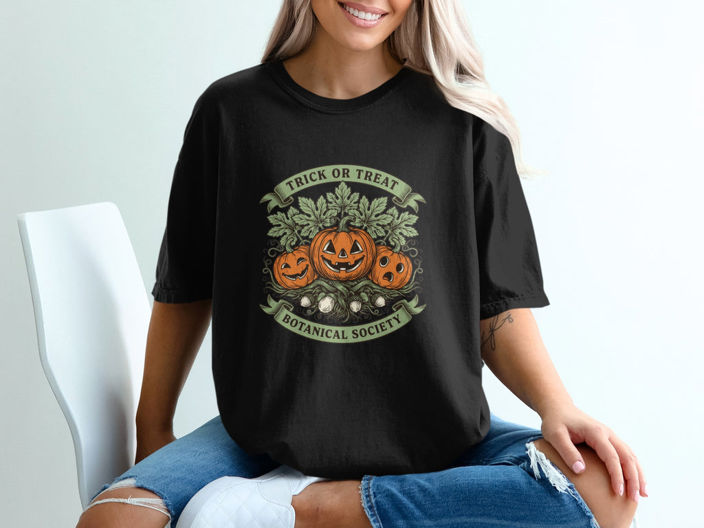 Black t-shirt with "Trick or Treat Botanical Society" and three pumpkins.