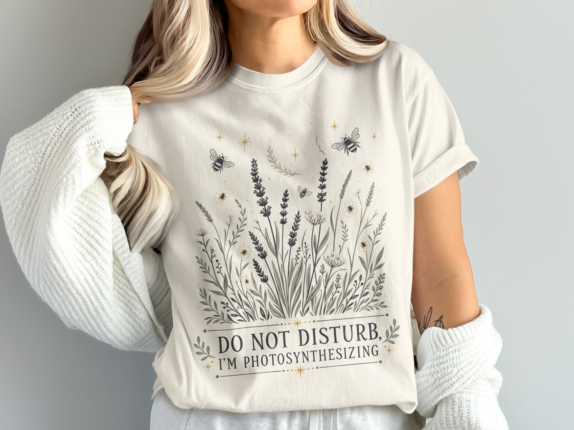 Cream t-shirt with "DO NOT DISTURB, I'M PHOTOSYNTHESIZING" text and botanical bee graphic.