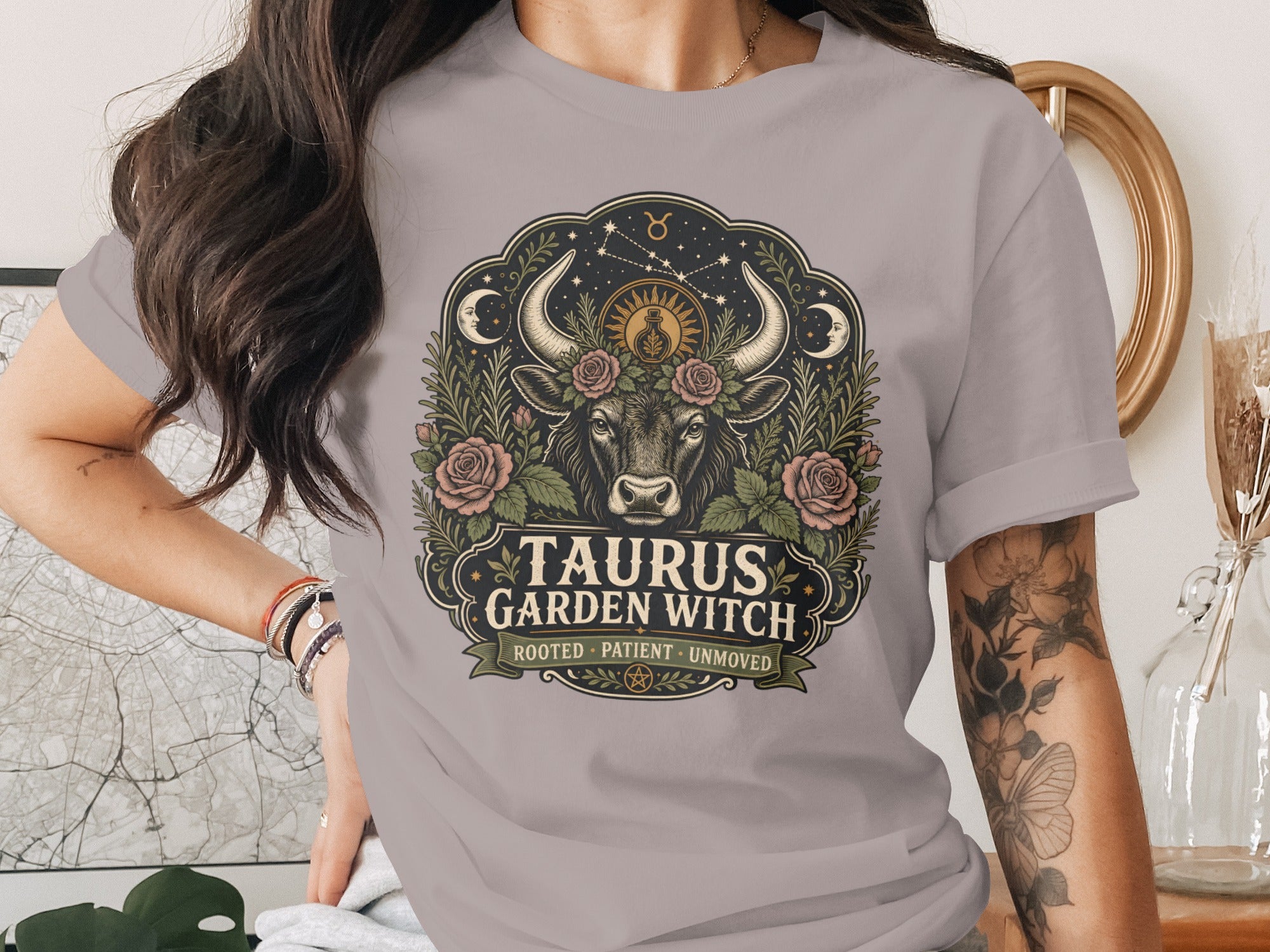 Taurus Garden Witch graphic tee with bull, roses, moon, and constellations.