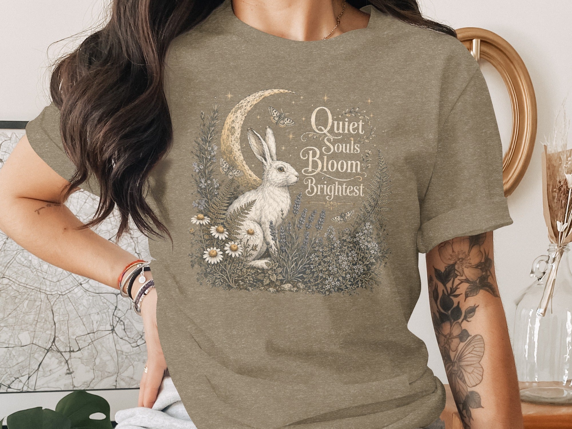 White rabbit with moon and butterflies, text "Quiet Souls Bloom Brightest."