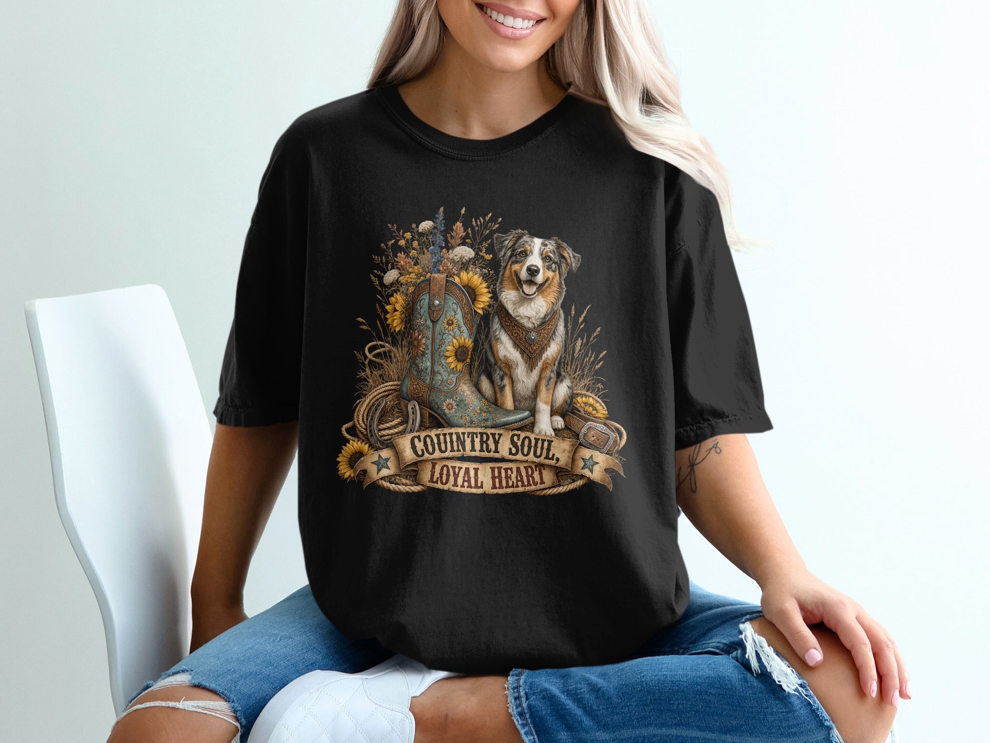 Black t-shirt graphic with cowboy boot, dog, sunflowers, and text "COUNTRY SOUL, LOYAL HEART".