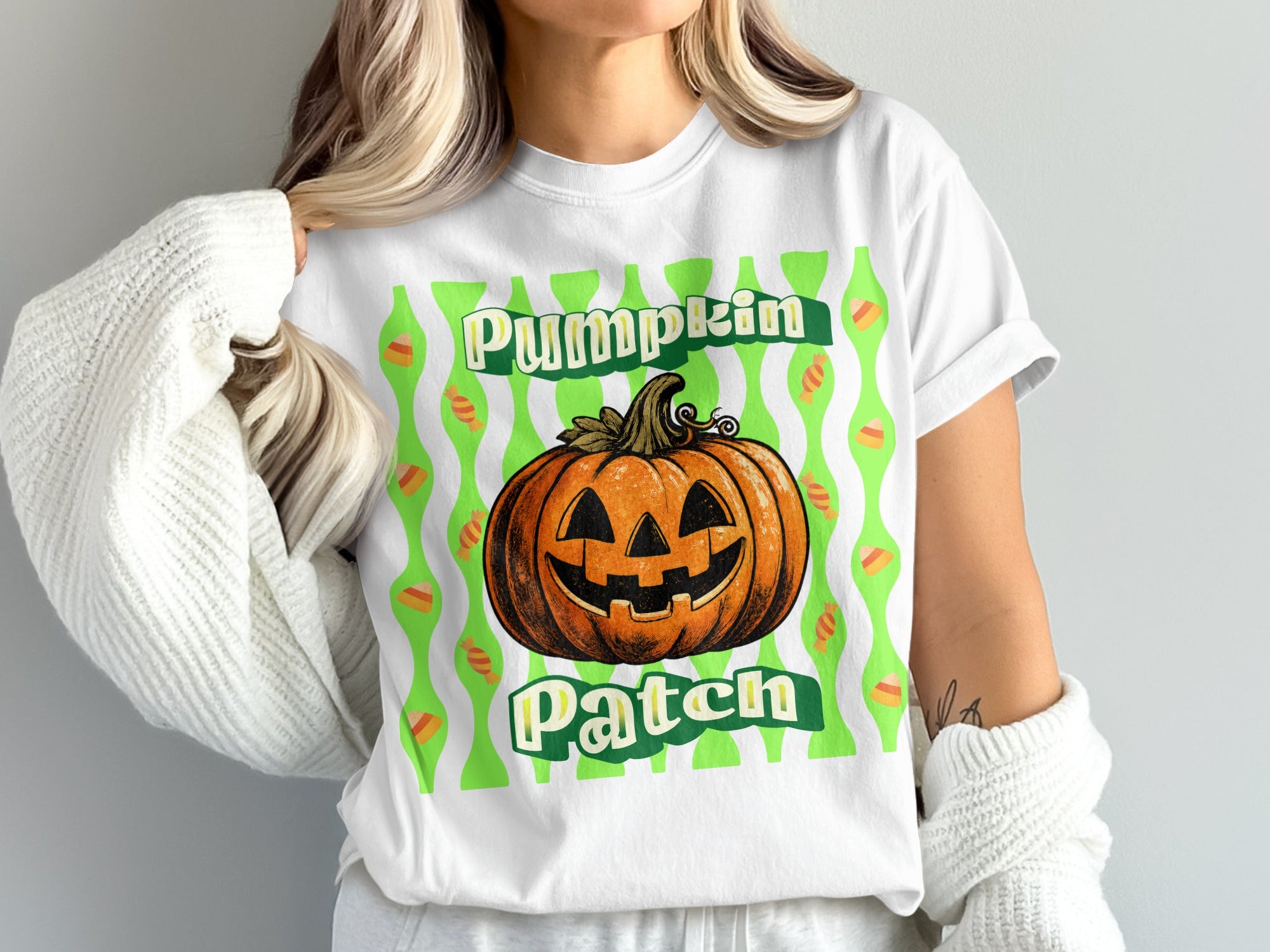 White t-shirt with jack-o'-lantern, "Pumpkin Patch" text, and candy corn pattern.