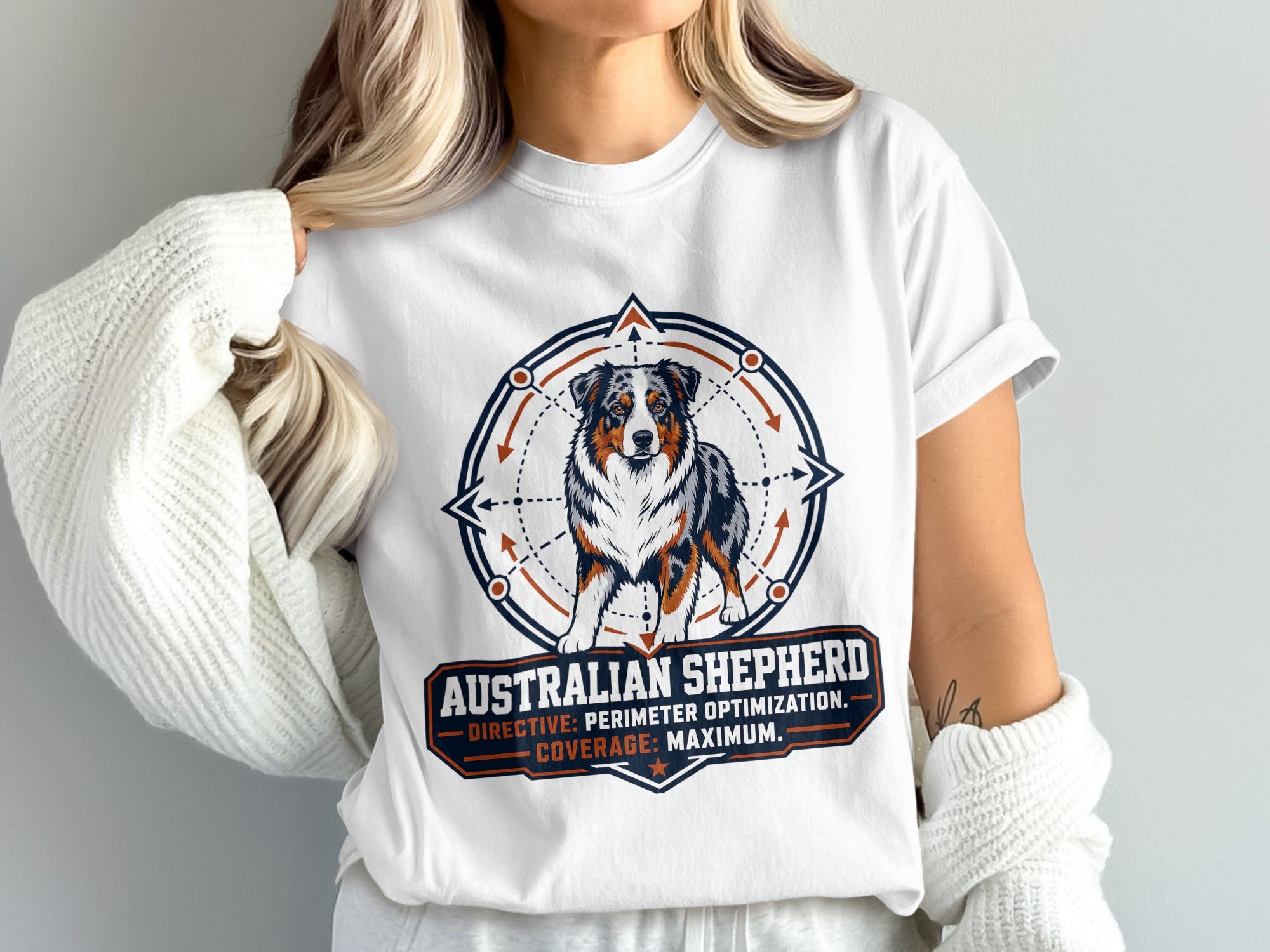 White t-shirt with Australian Shepherd illustration and text: "AUSTRALIAN SHEPHERD DIRECTIVE: PERIMETER OPTIMIZATION. COVERAGE: MAXIMUM."