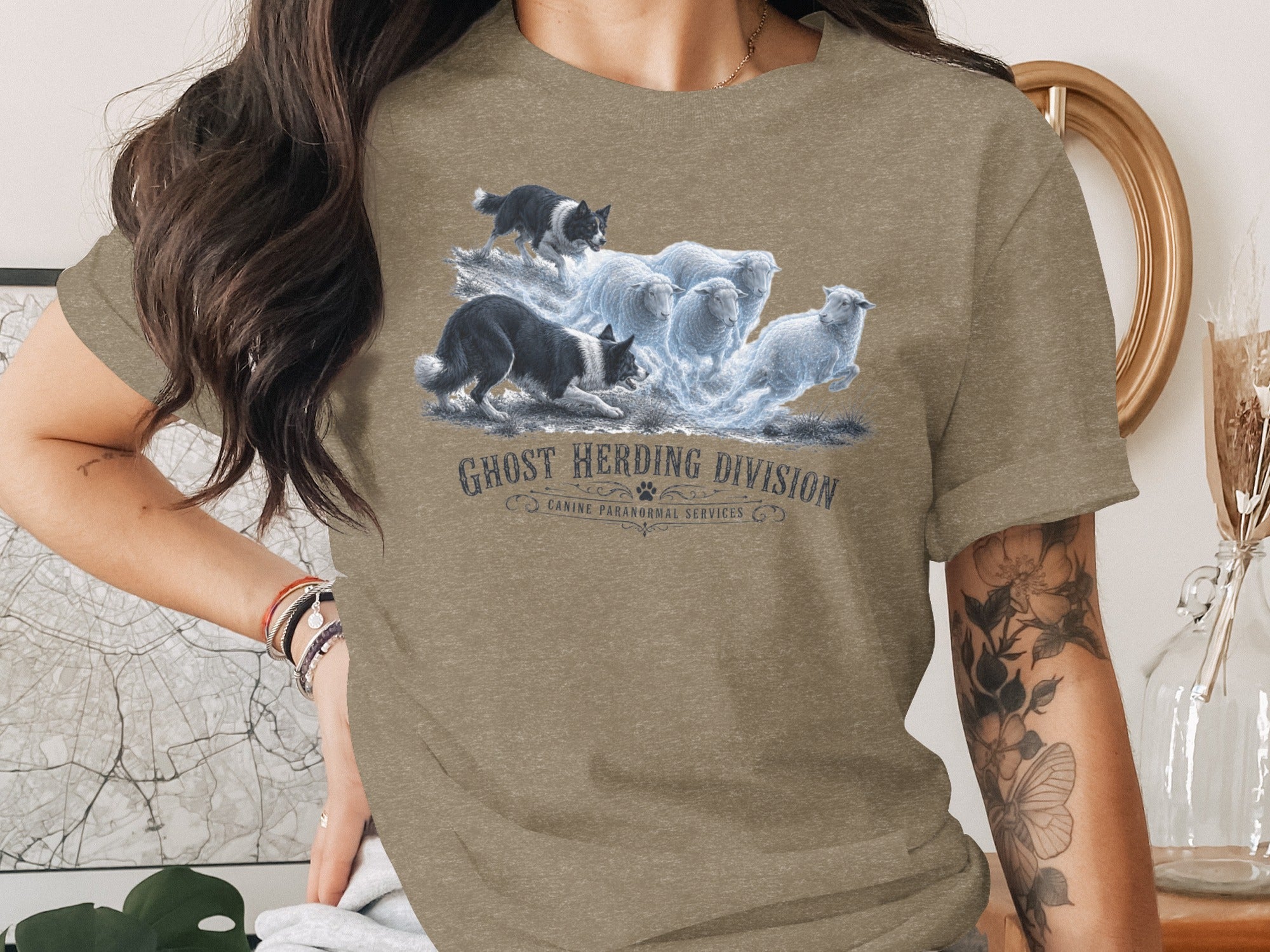 Graphic of dogs herding glowing sheep with text "Ghost Herding Division".
