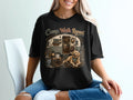 Black t-shirt with camper, dog, and "Camp. Walk. Repeat." text.