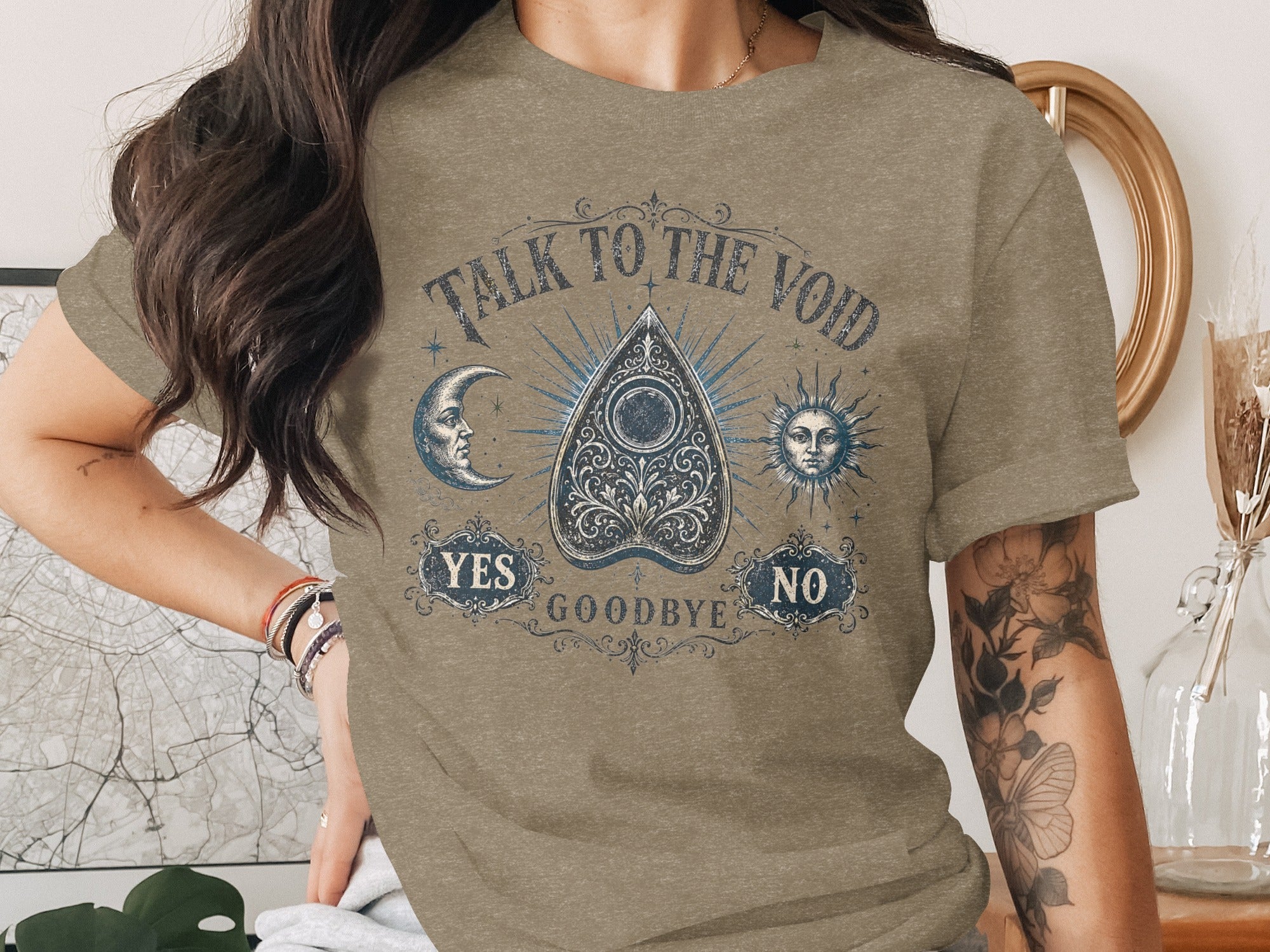 Taupe t-shirt with "Talk to the Void" and ouija design.