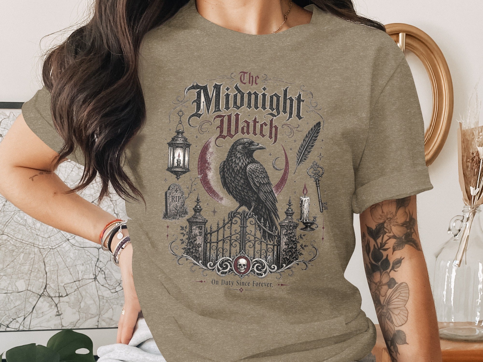 T-shirt with gothic bird, crescent moon, and "The Midnight Watch" text.