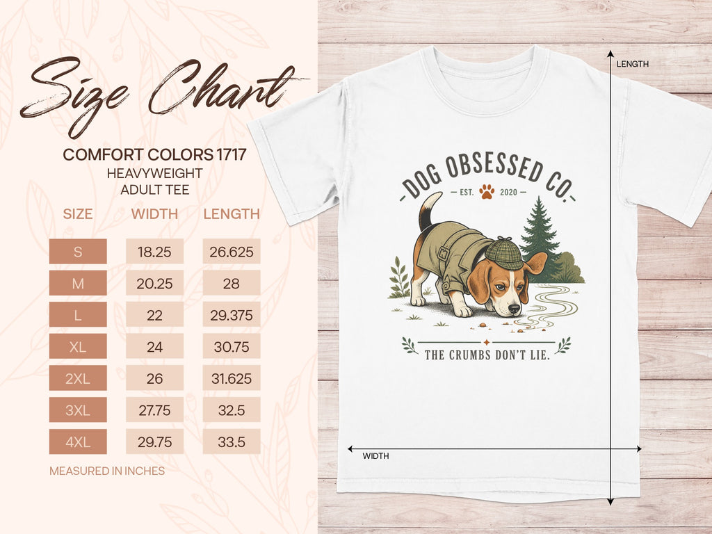 Size chart for adult tees, with dog graphic and text "The Crumbs Don't Lie."