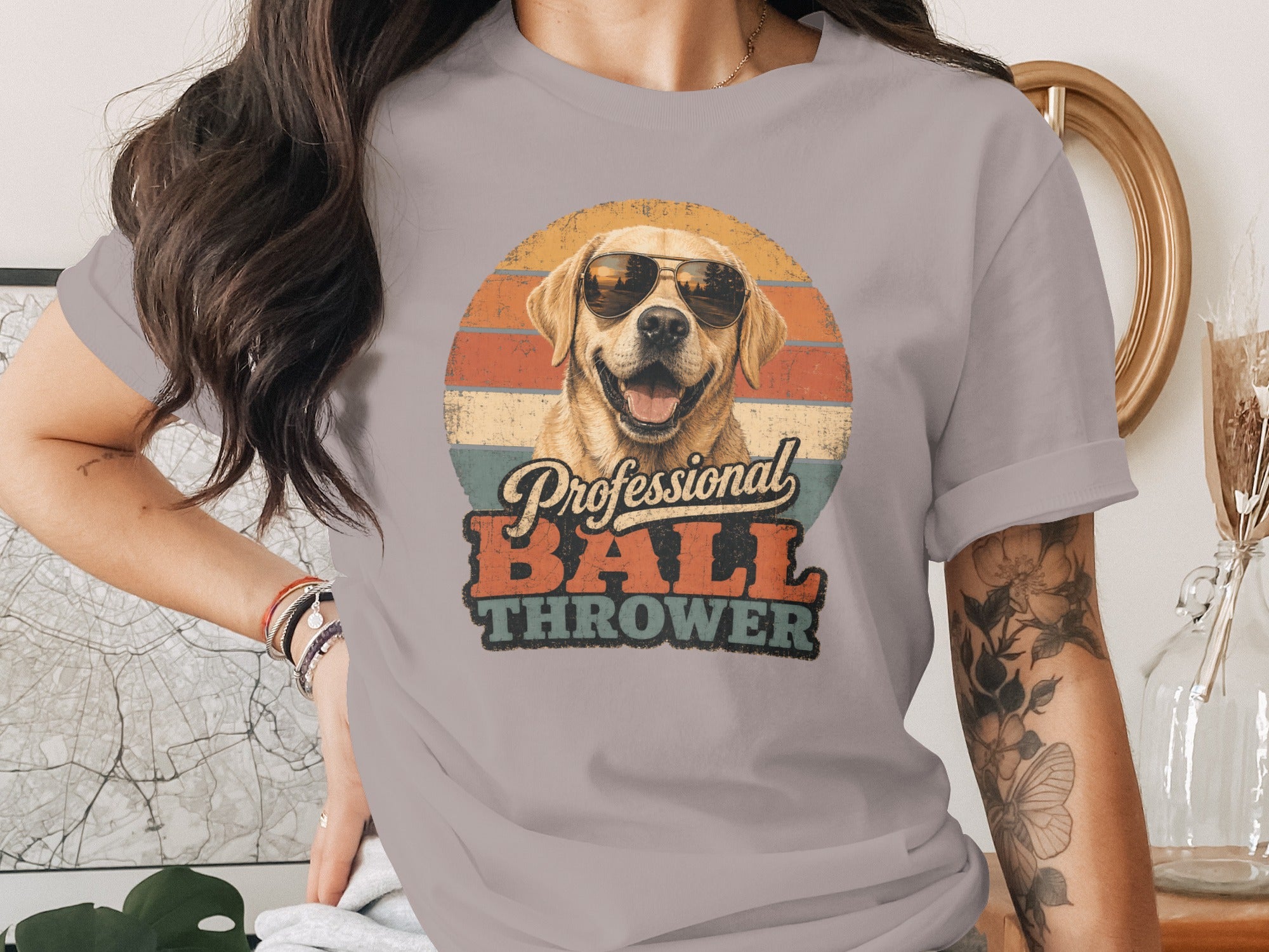 Labrador wearing sunglasses with text "Professional Ball Thrower".