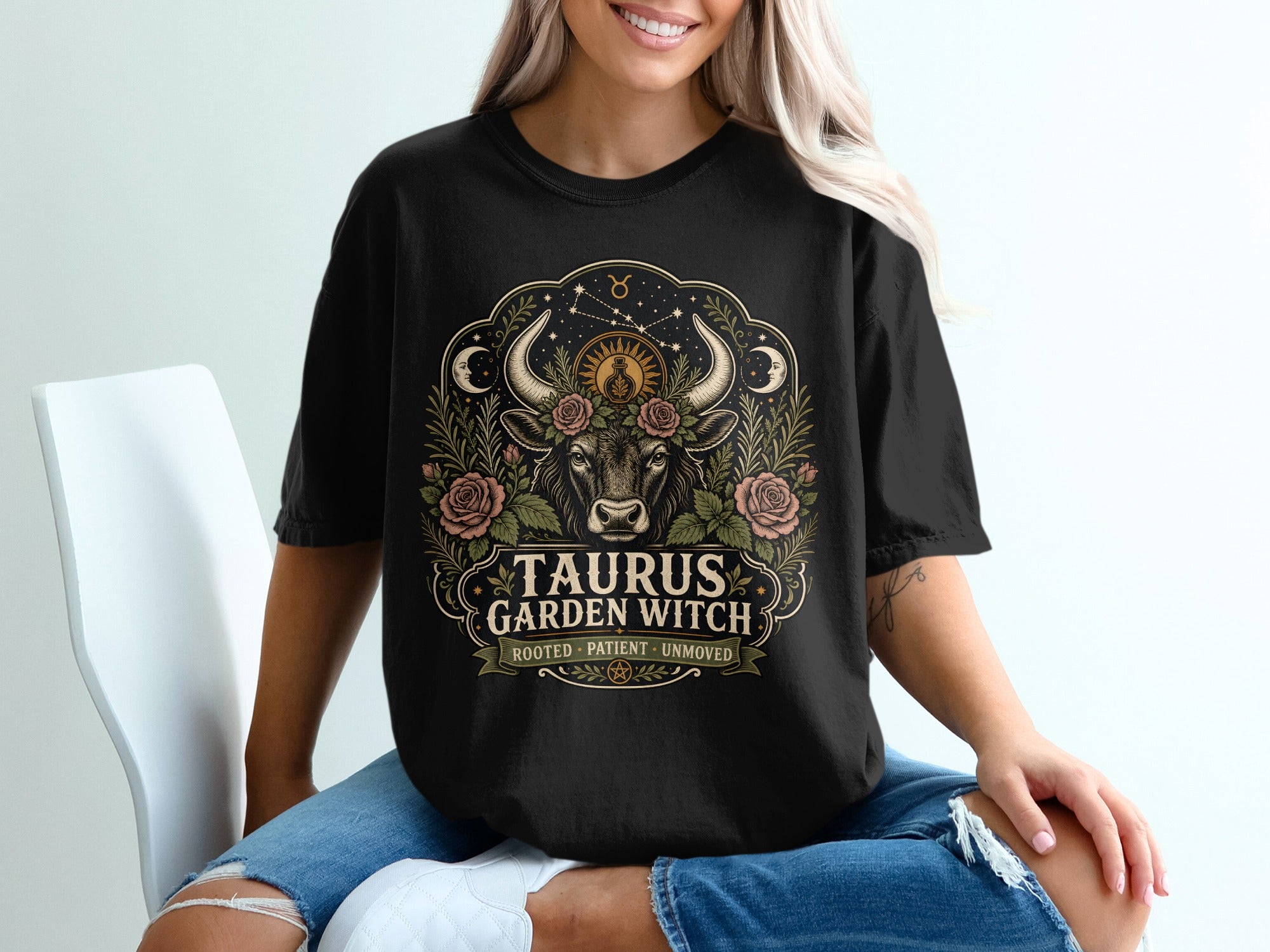 Taurus Garden Witch graphic on black shirt with bull, roses, moons, and stars.