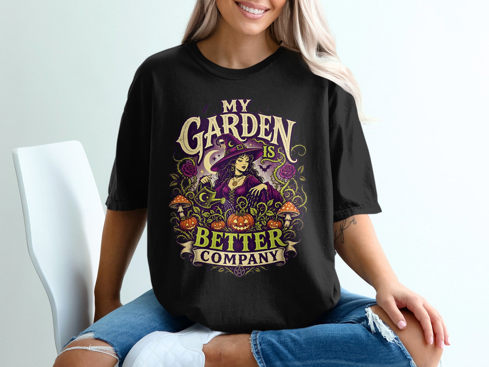 Black t-shirt with "My Garden is Better Company" text and witch graphic.