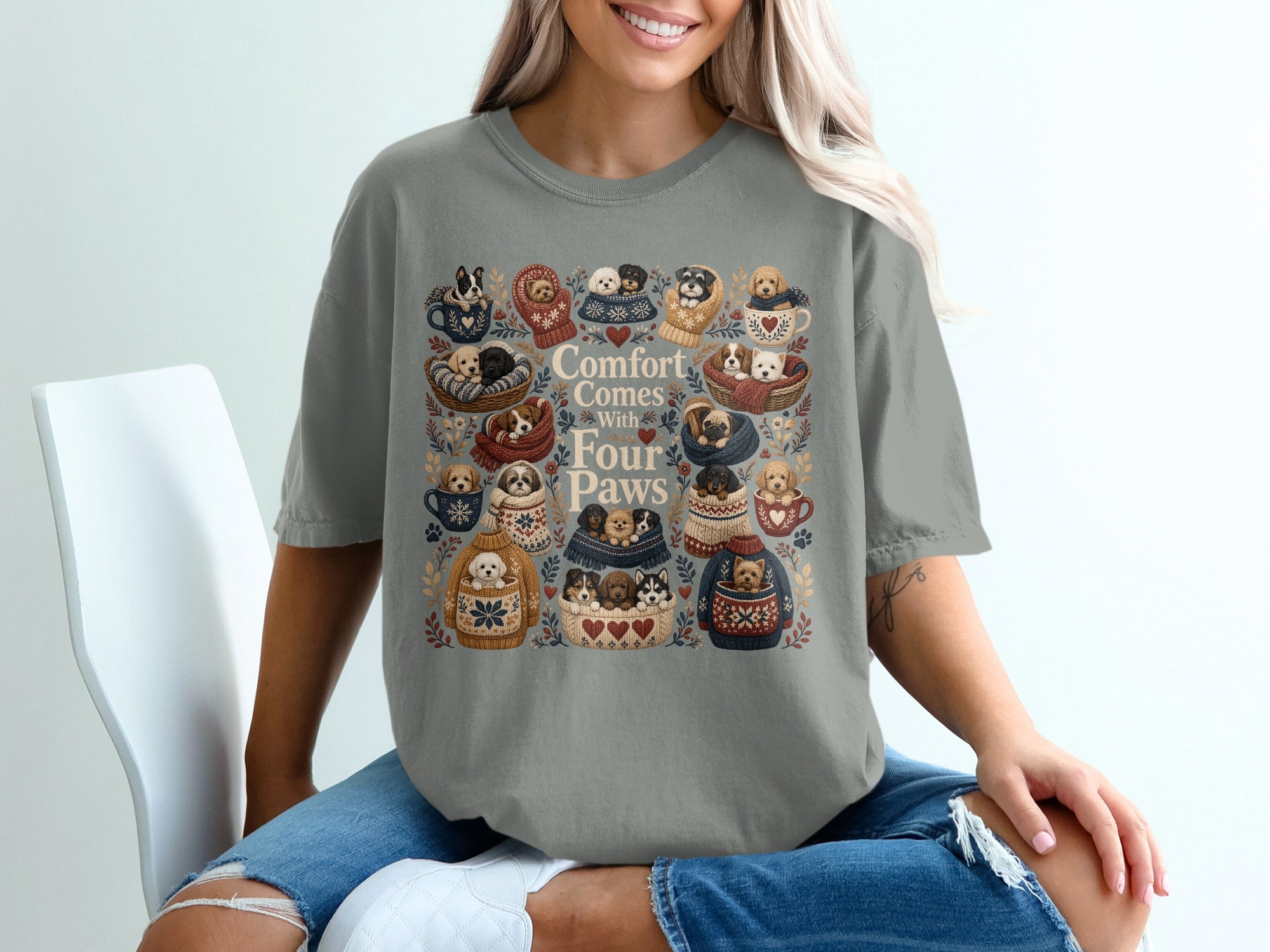 Gray t-shirt with "Comfort Comes With Four Paws" and illustrations of puppies in sweaters.