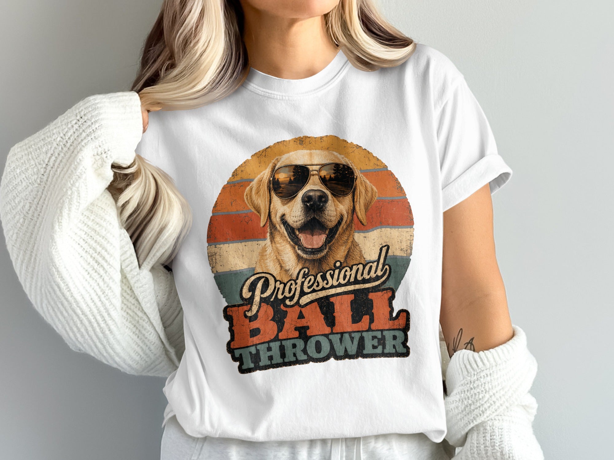 Golden retriever wearing sunglasses with "Professional Ball Thrower" text.