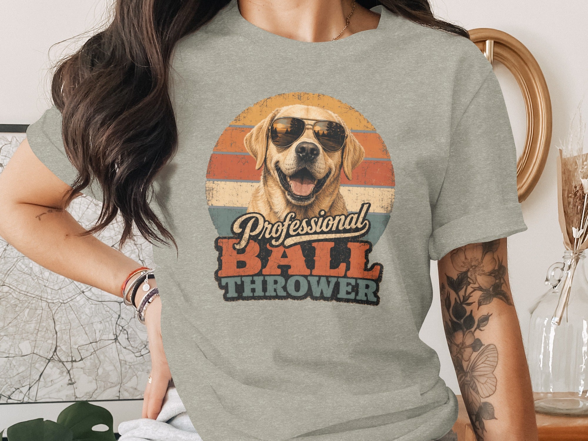 Dog wearing sunglasses with text "Professional Ball Thrower"