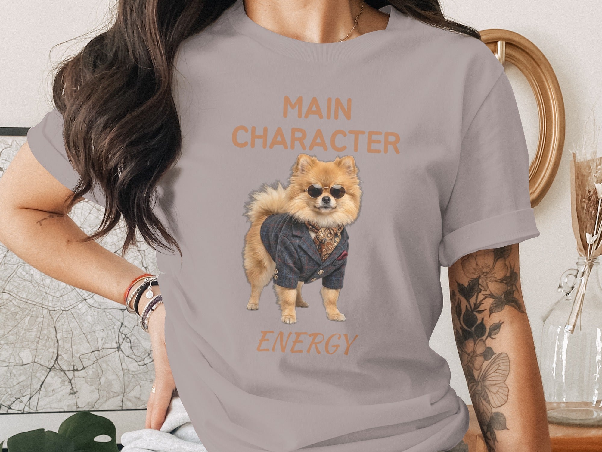 T-shirt with a Pomeranian dog wearing a suit, sunglasses, and text "MAIN CHARACTER ENERGY".
