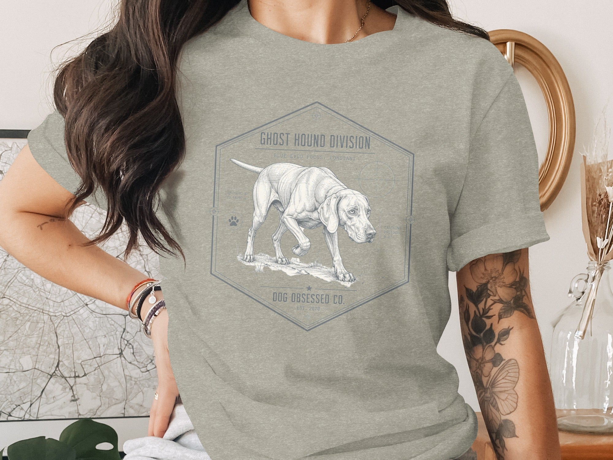 T-shirt with line art design of a hunting dog with text "Ghost Hound Division" and "Dog Obsessed Co."