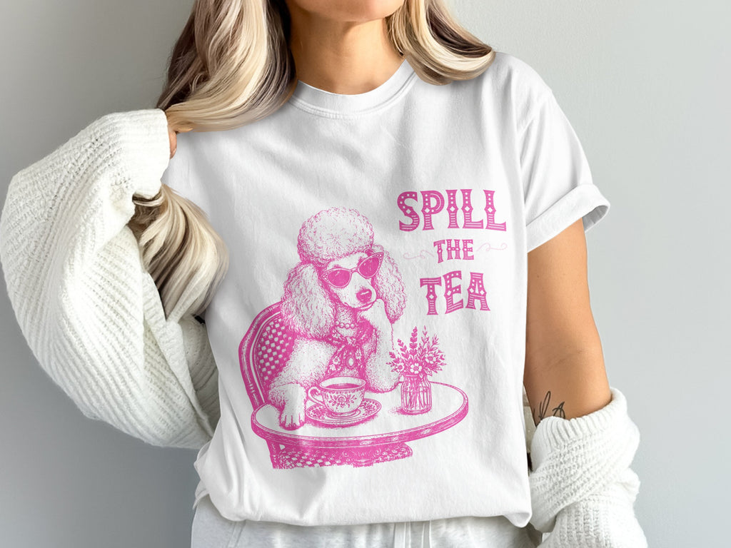 White t-shirt with pink poodle graphic saying "Spill the Tea".