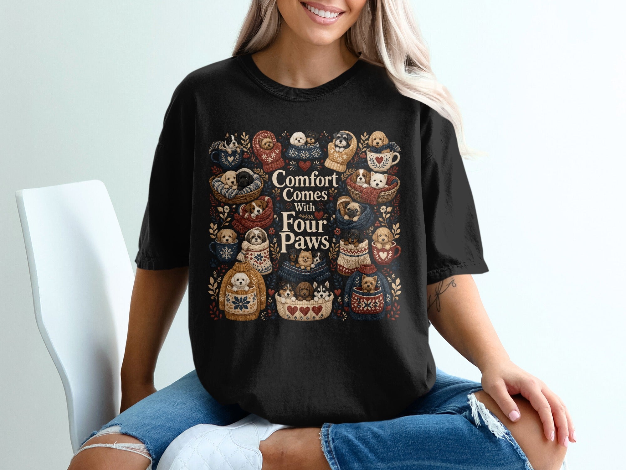 Black t-shirt with "Comfort Comes With Four Paws" and cute puppies in cozy settings.
