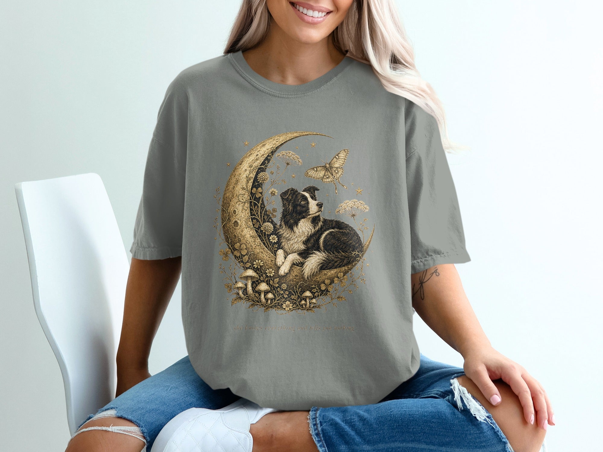 T-shirt with golden moon, dog, mushrooms, and text.