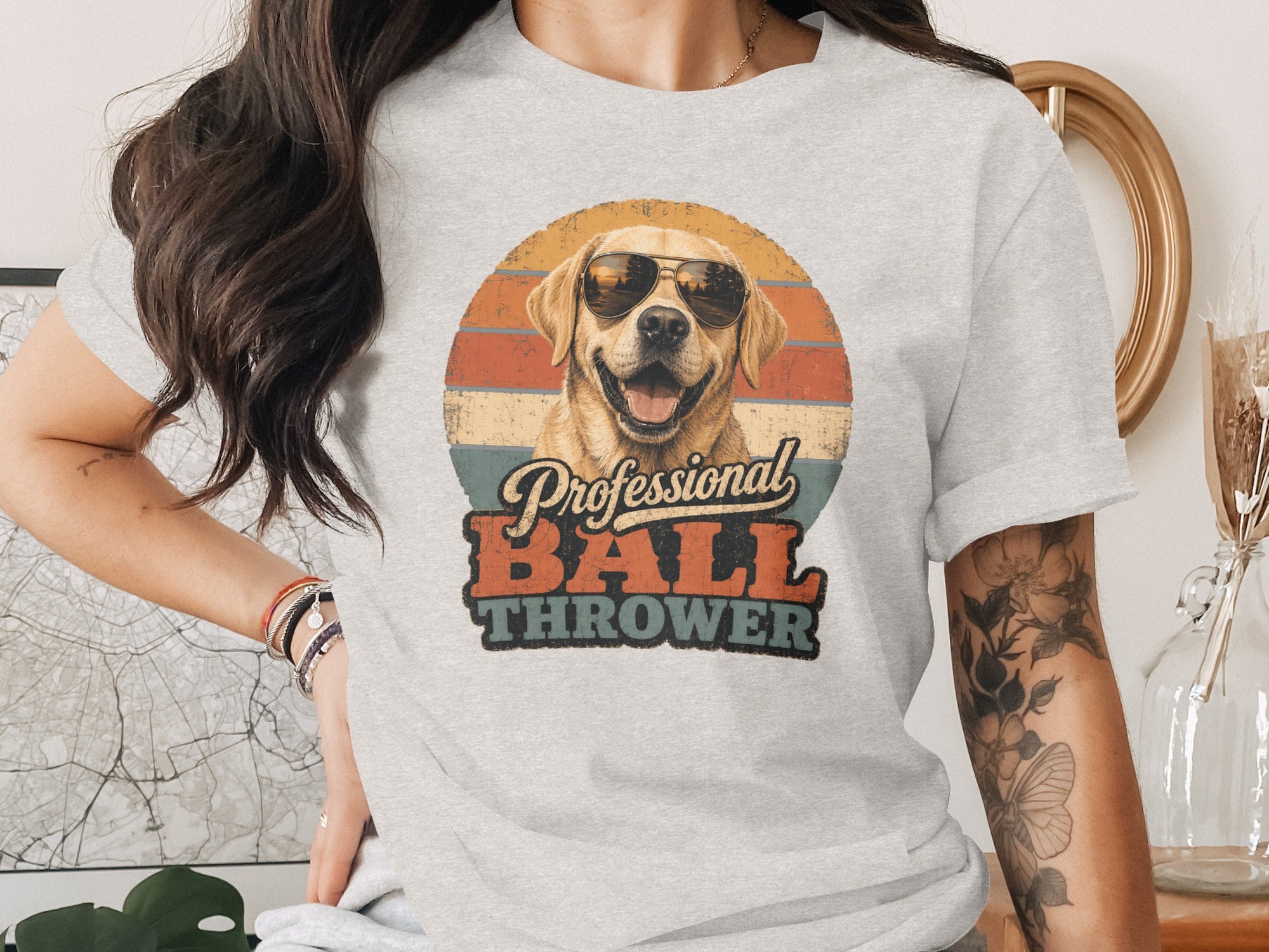 Labrador retriever wearing sunglasses with text "Professional Ball Thrower."