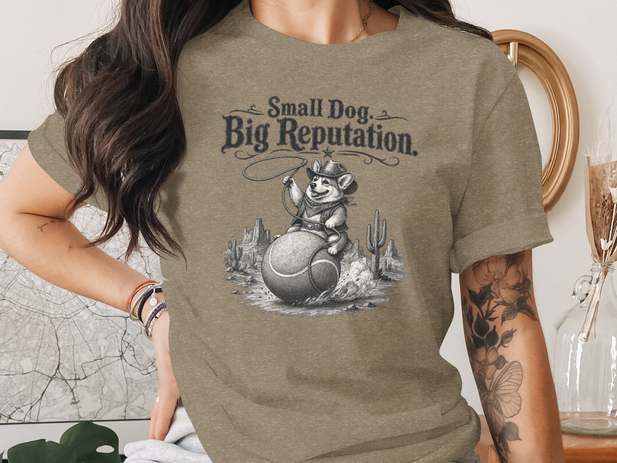 Corgi in cowboy hat on a tennis ball with "Small Dog, Big Reputation" text.