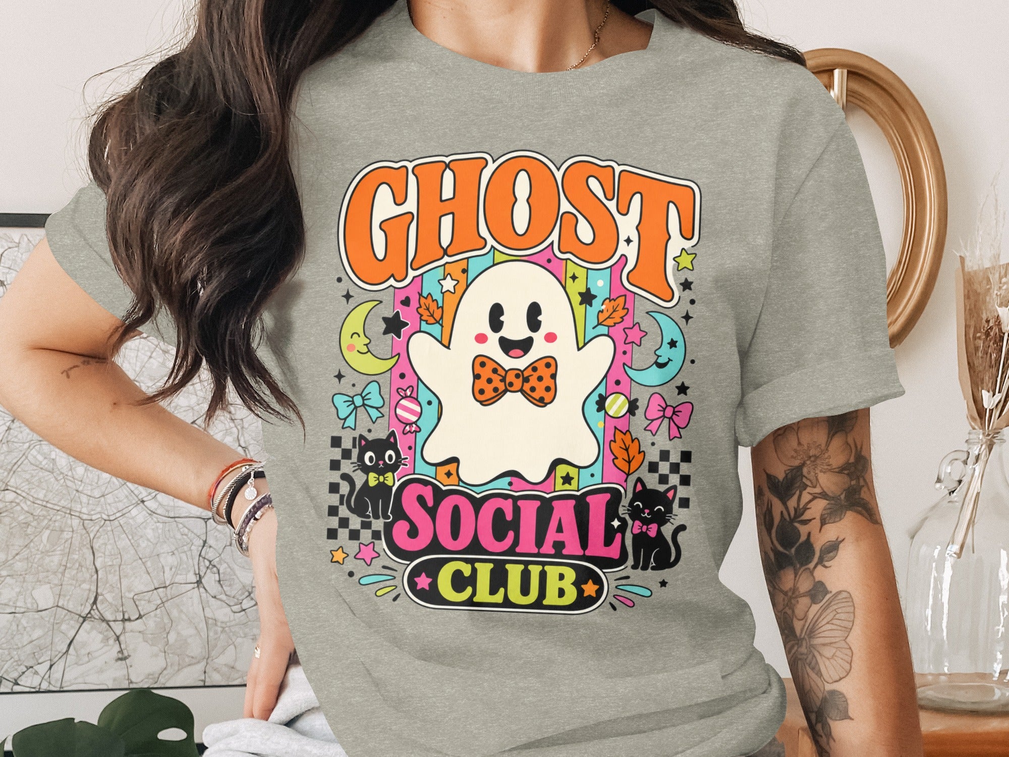 Ghost Social Club Halloween graphic with a ghost, cats, moons, stars, and leaves.