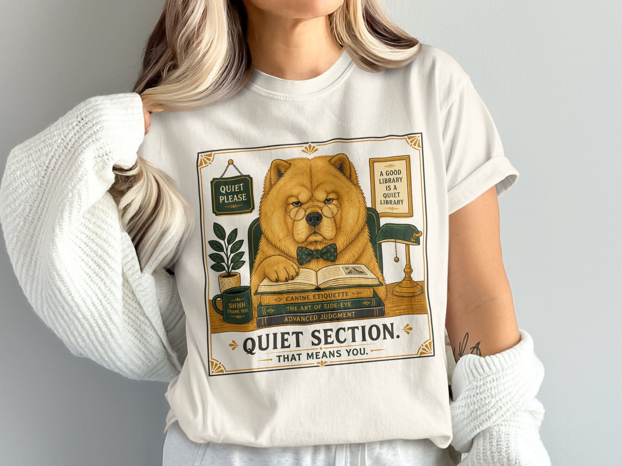 Cream t-shirt featuring a dog in glasses reading with text "Quiet Section. That Means You."