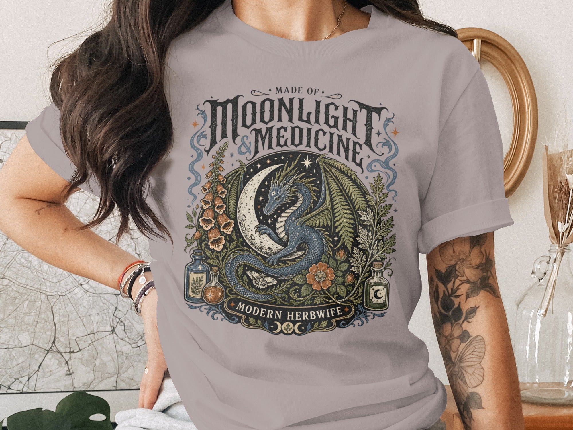 Dragon coiled around moon with text "Made of Moonlight & Medicine Modern Herbwife."