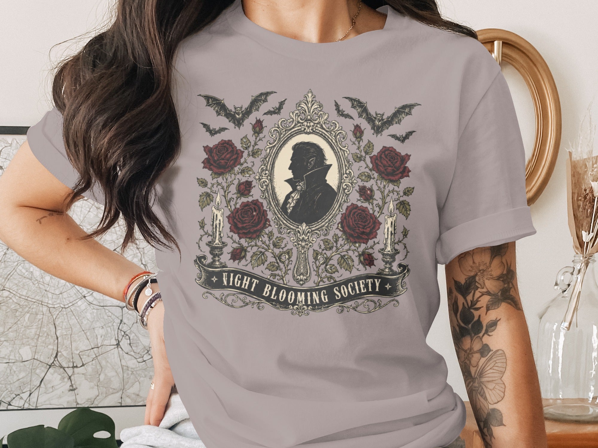 T-shirt with gothic design: vampire silhouette, roses, bats, candles, and "Night Blooming Society" text.