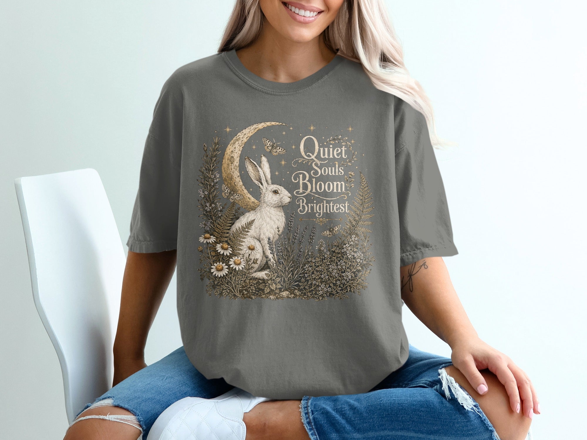 Gray t-shirt with rabbit, moon, and text "Quiet Souls Bloom Brightest".