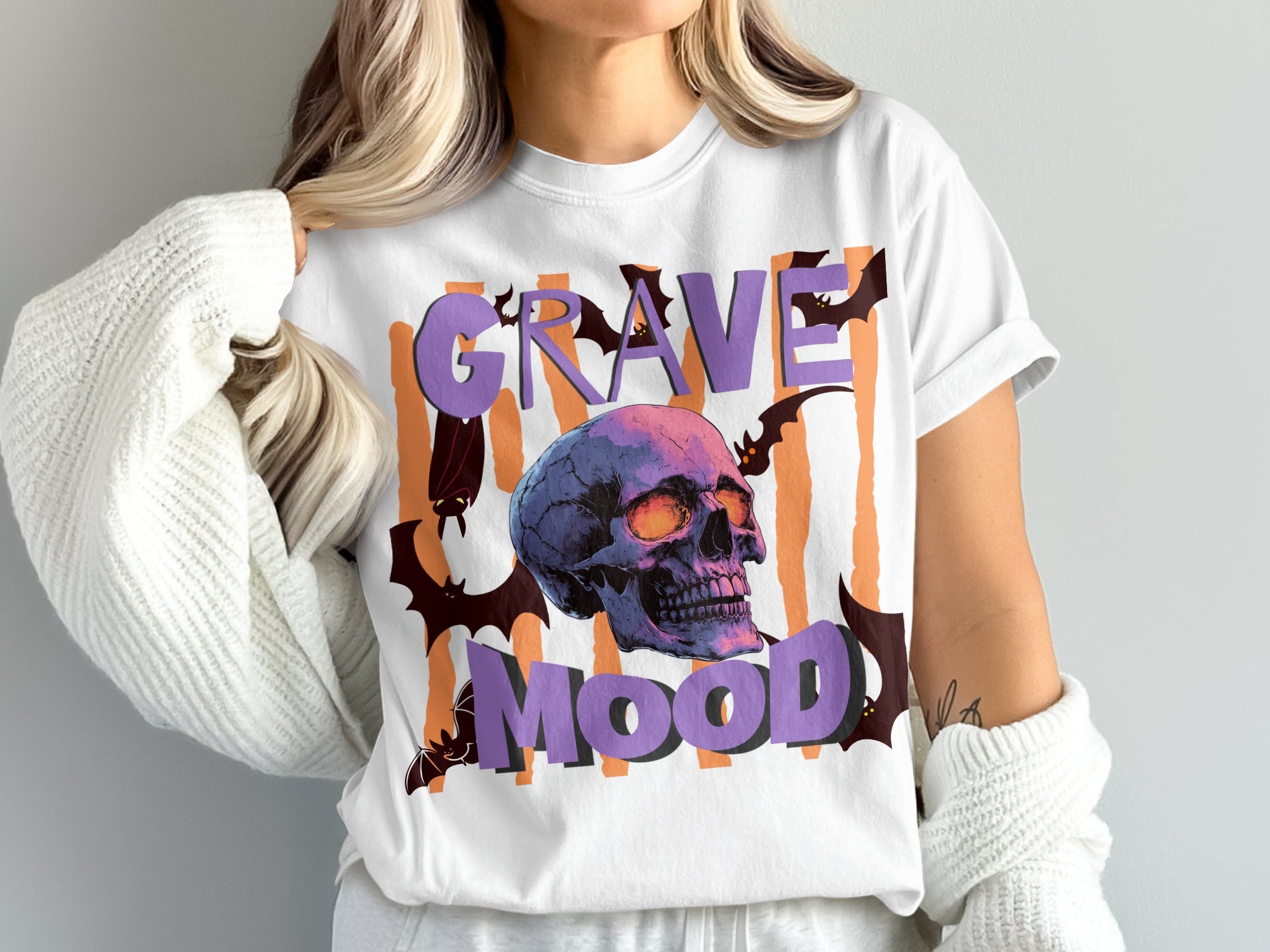 White t-shirt with a skull, bats, and text "Graveyard Mood" design.