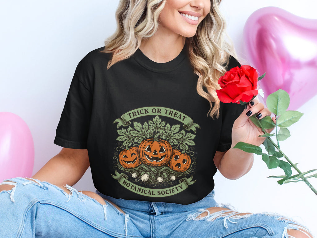 Black t-shirt with Halloween pumpkins and text "Trick or Treat Botanical Society".