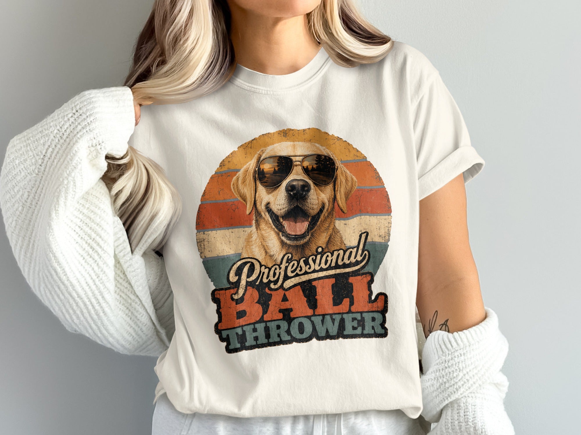 Golden retriever wearing sunglasses with text "Professional BALL THROWER".