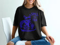 Black t-shirt with a blue graphic of a french bulldog wearing heart sunglasses and the text "Spill the Tea."