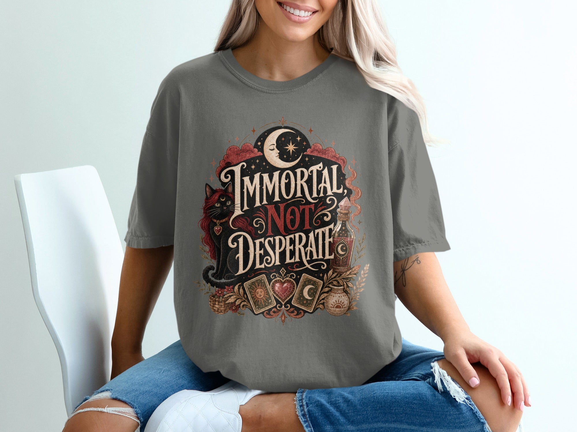 T-shirt graphic with black cat, crescent moon, and "Immortal Not Desperate" text.