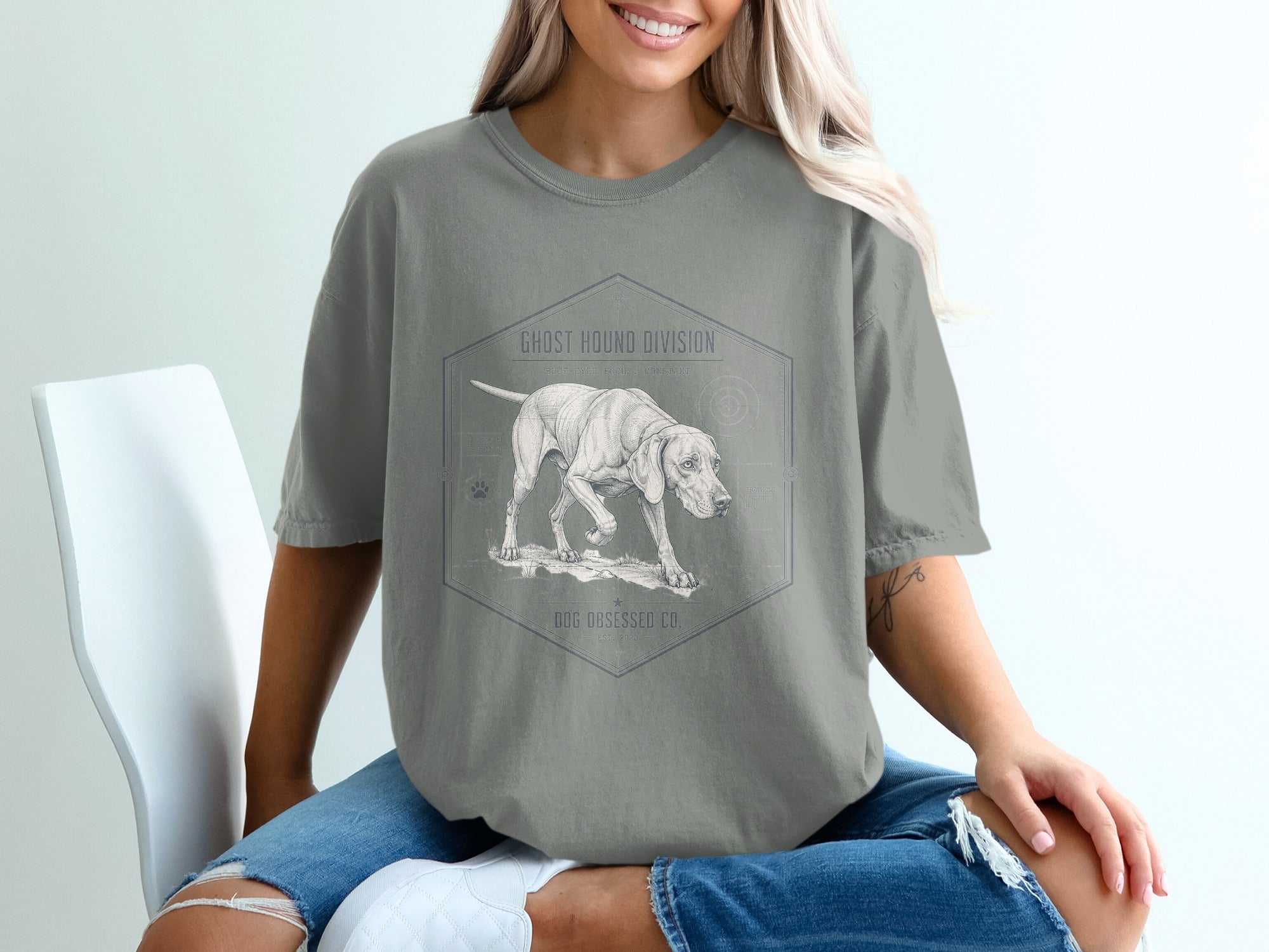 Gray t-shirt with a drawing of a dog and text "Ghost Hound Division."