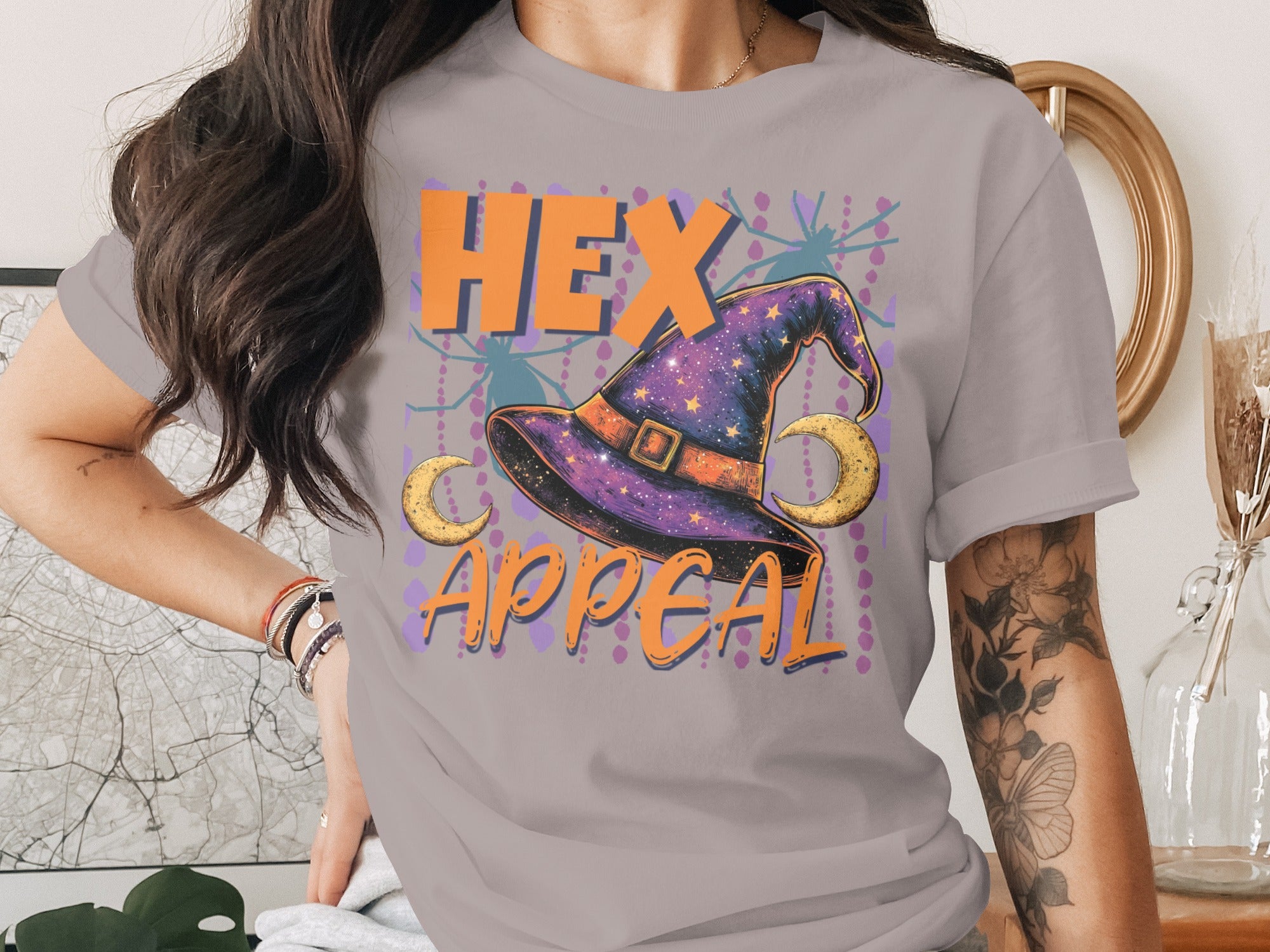"HEX APPEAL" text with a purple starry witch hat and moons on a gray t-shirt.