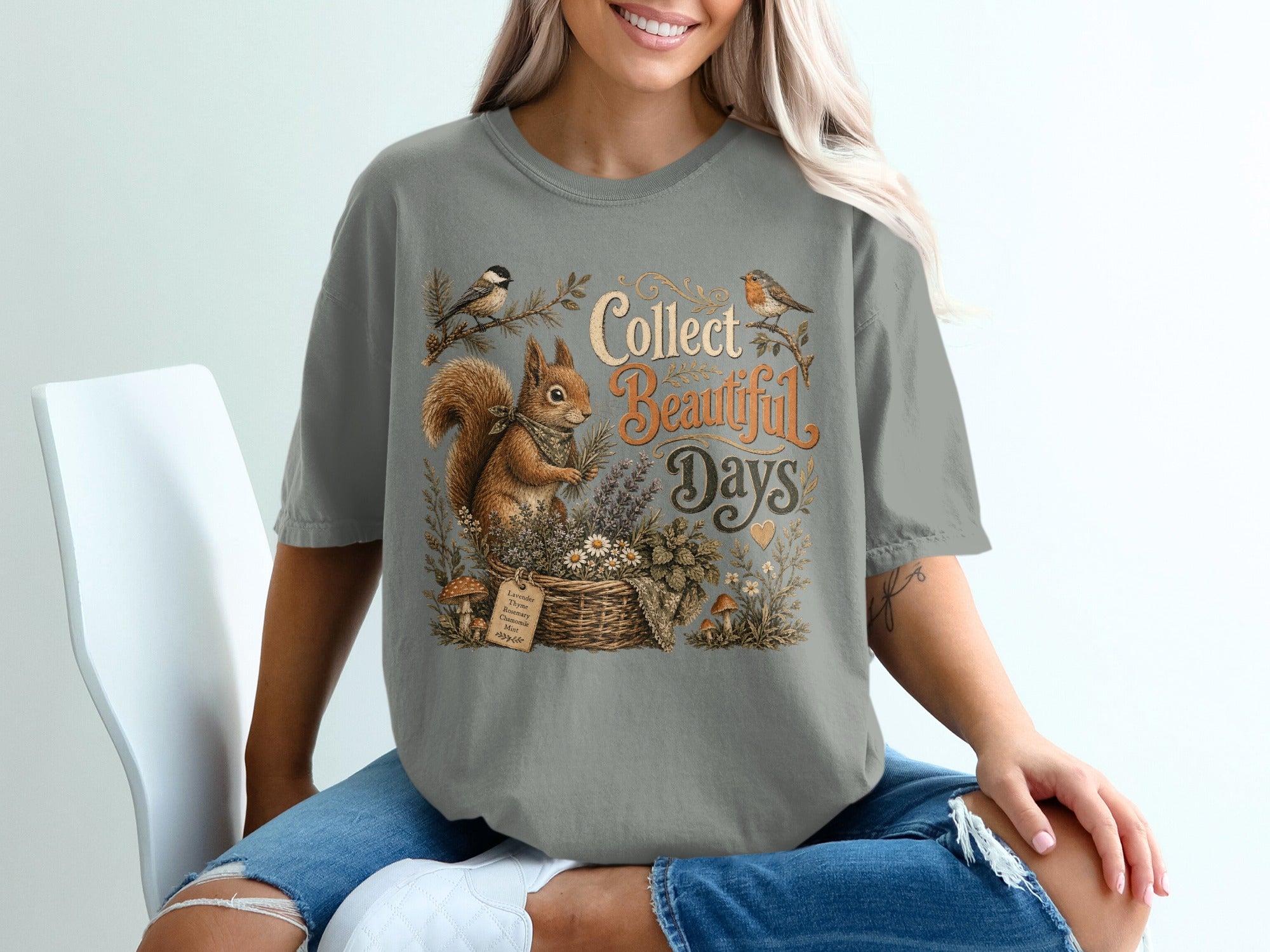 T-shirt with squirrel, birds, basket of flowers, and text "Collect Beautiful Days".