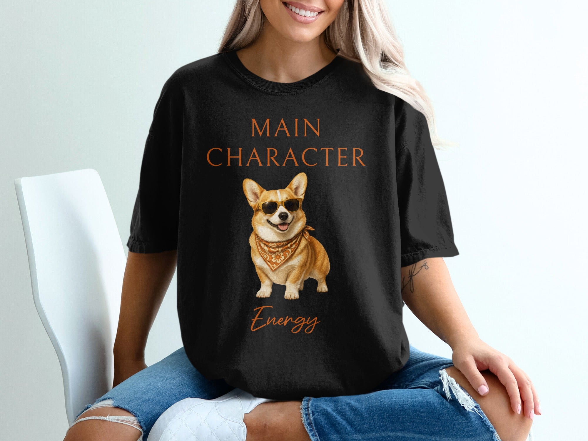 Black t-shirt with "Main Character Energy" text and a corgi dog wearing sunglasses.