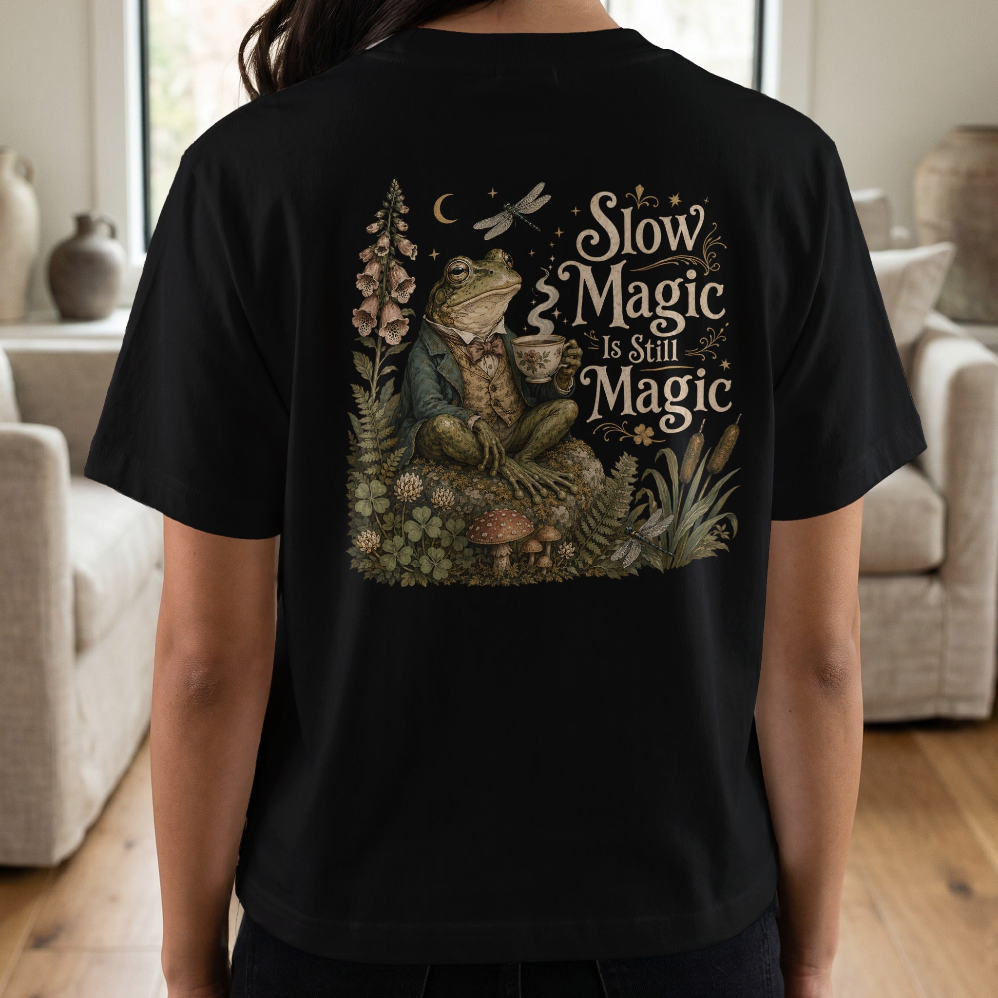 Frog in a suit holding a teacup, with text "Slow Magic Is Still Magic".