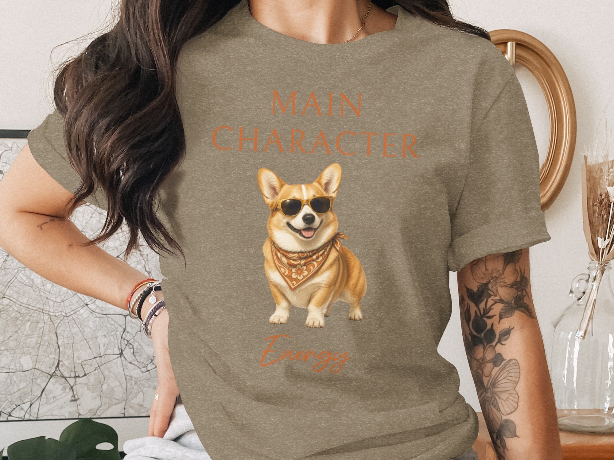Grey t-shirt with "MAIN CHARACTER Energy" text and a corgi wearing sunglasses.