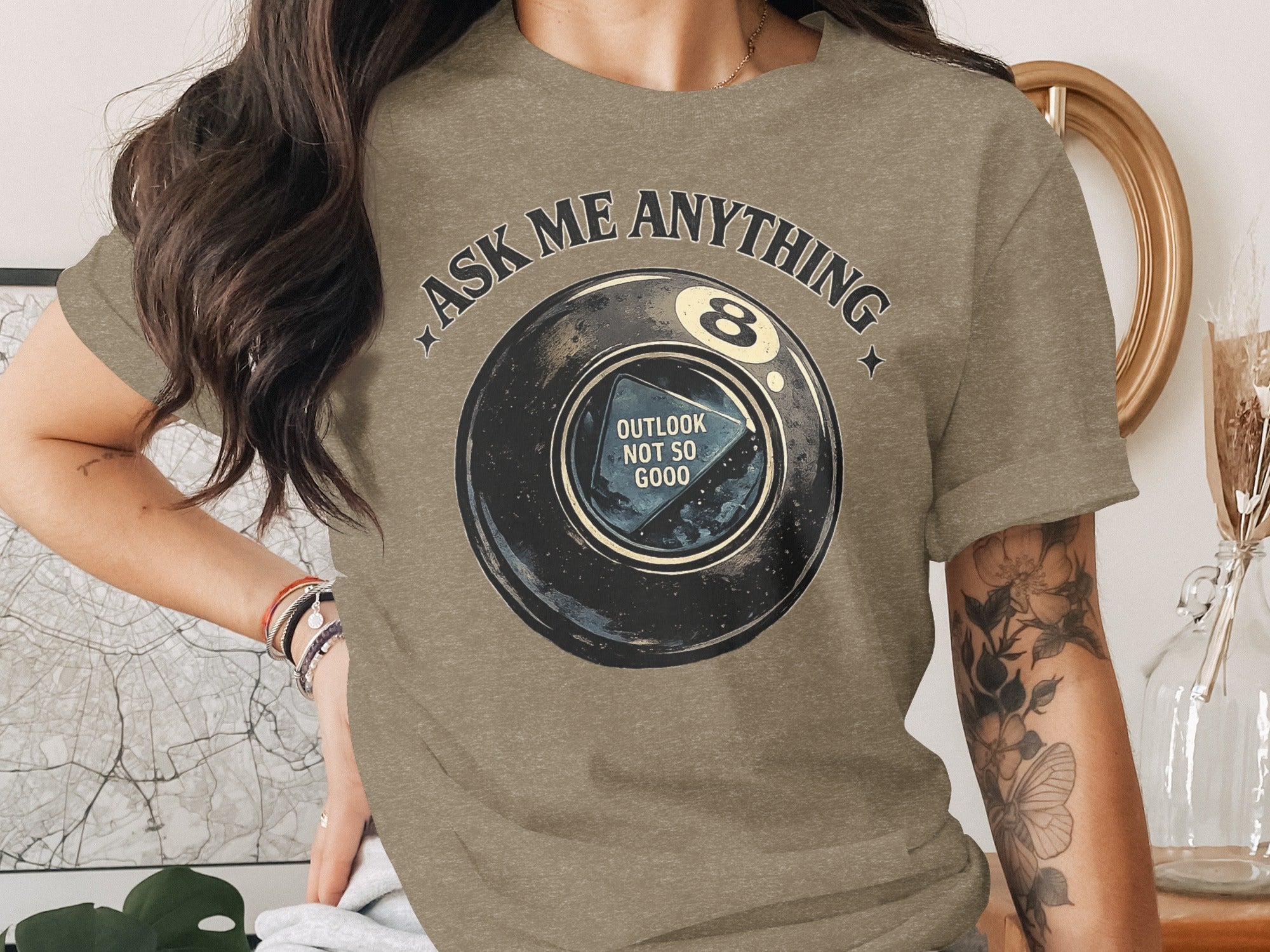 T-shirt with "Ask Me Anything" and 8-ball showing "Outlook Not So Good".