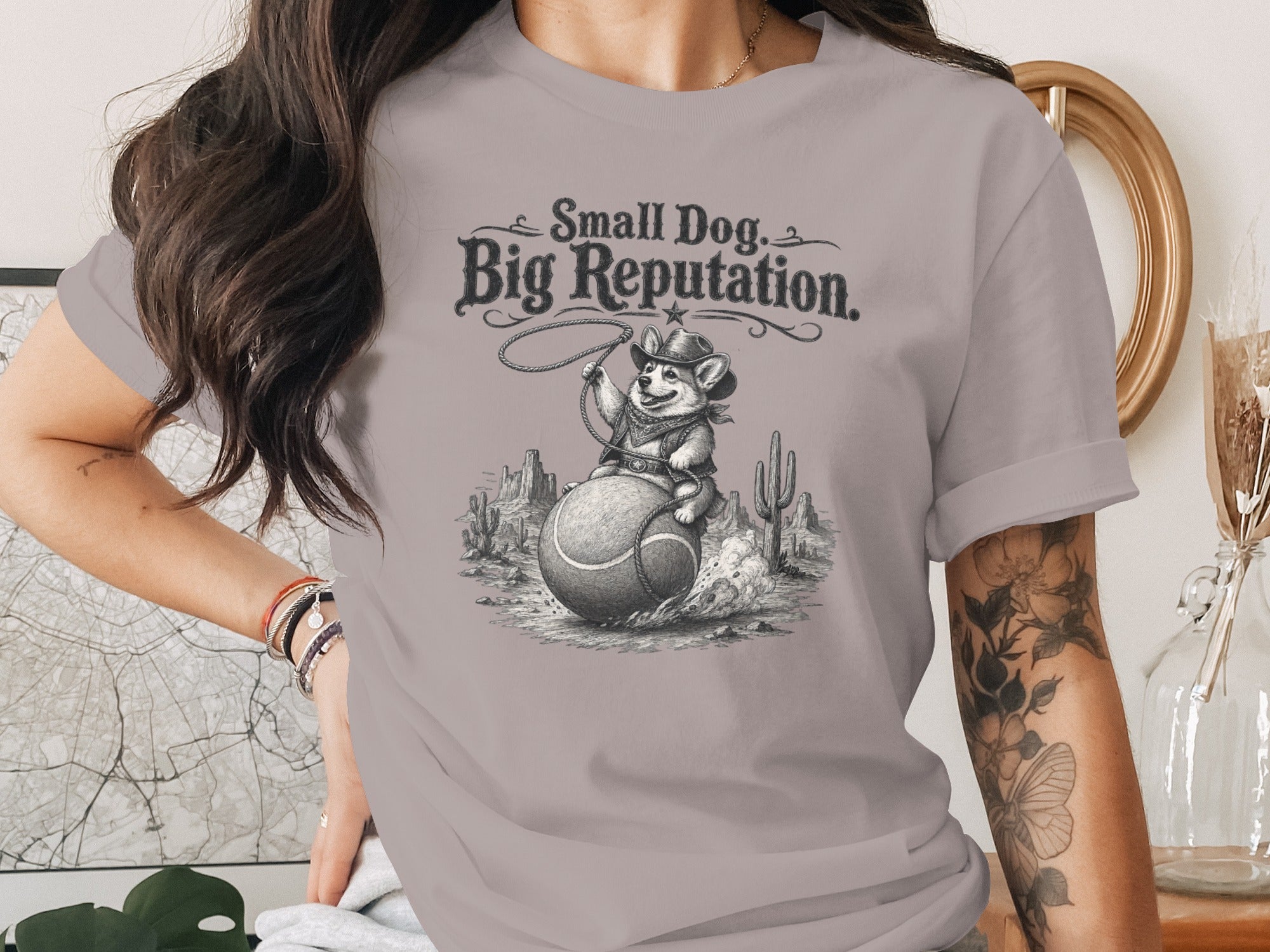 Corgi cowboy on tennis ball with text "Small Dog. Big Reputation."