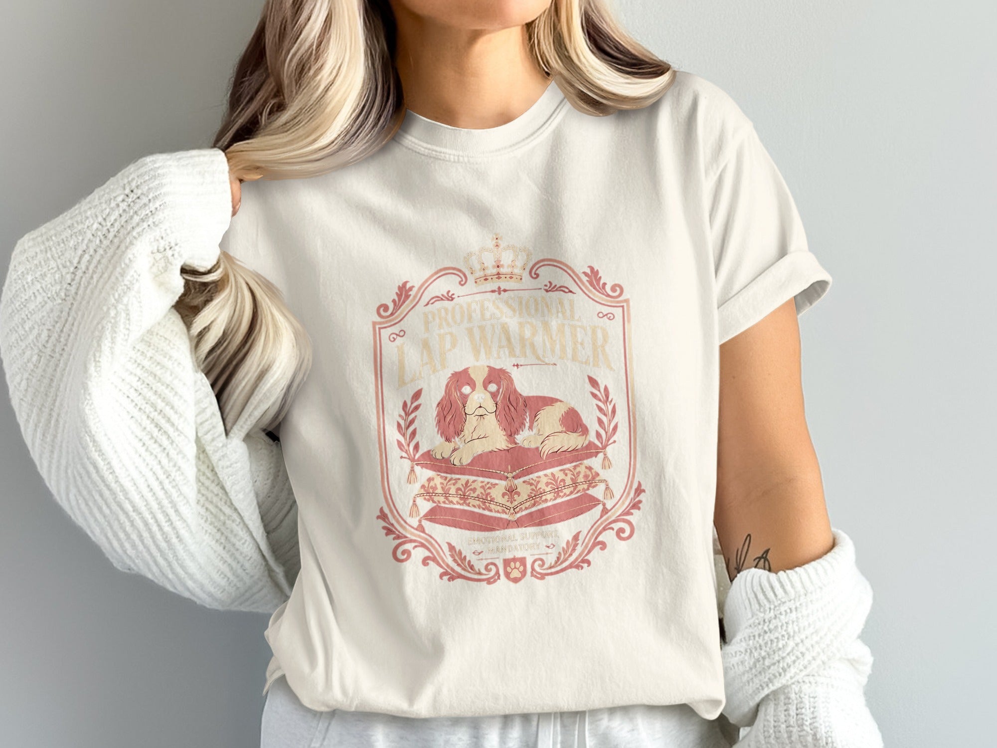 Cream t-shirt with "PROFESSIONAL LAP WARMER" text and a dog on pillows.