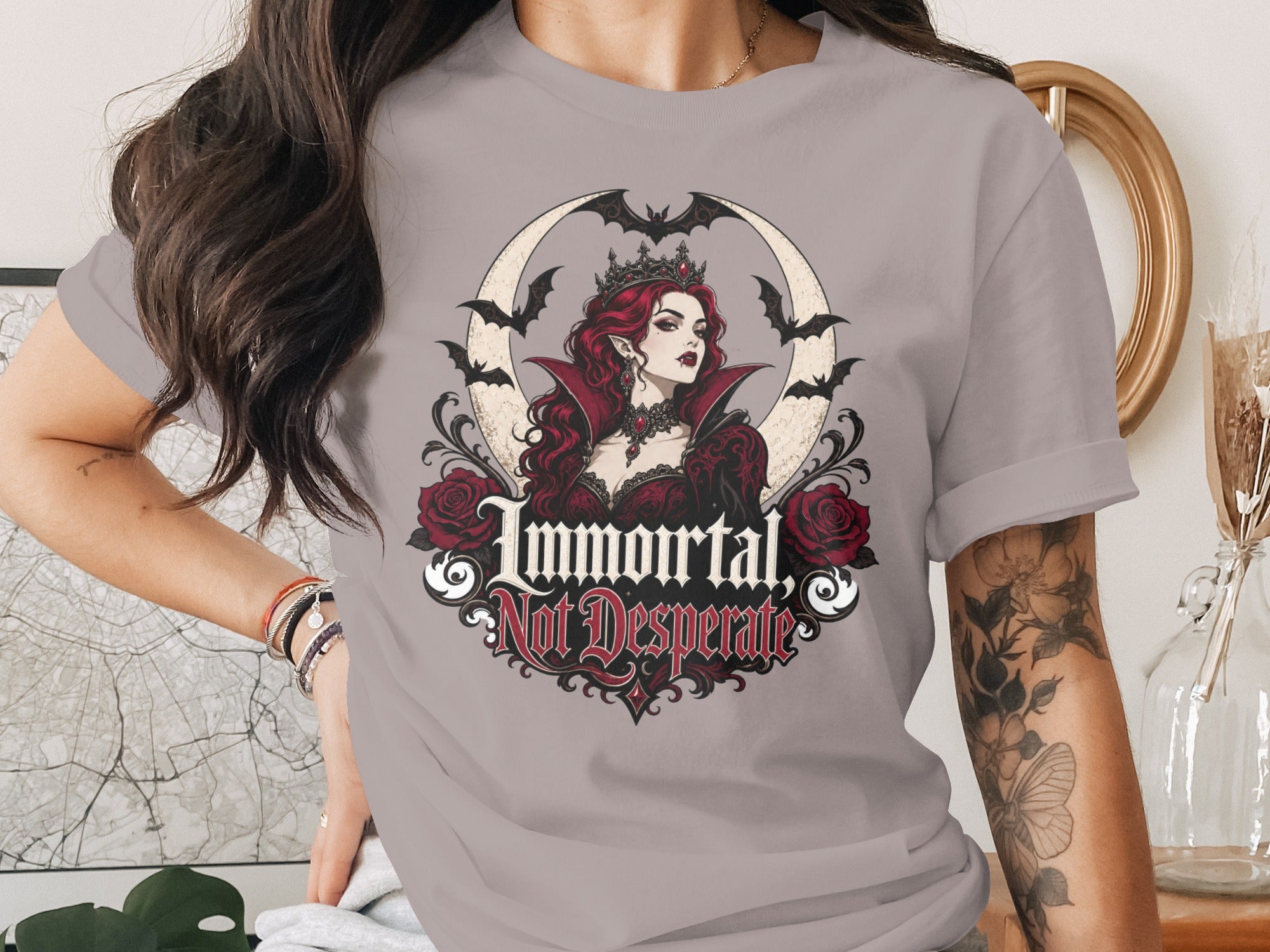 T-shirt graphic with vampire queen, bats, roses, and text "Immortal, Not Desperate".
