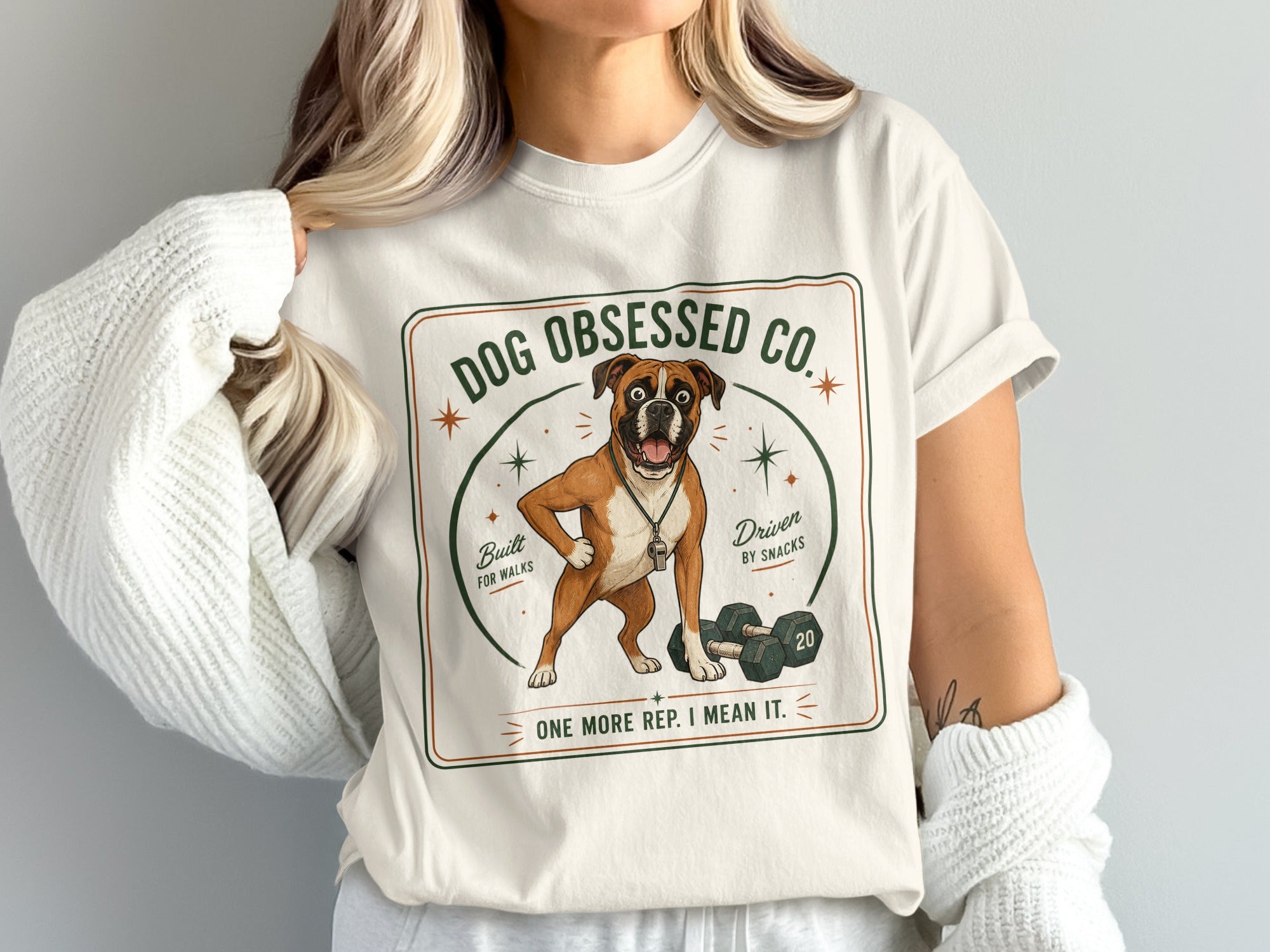Boxer dog graphic on shirt, "Dog Obsessed Co." text, dumbbell and text "one more rep. I mean it."