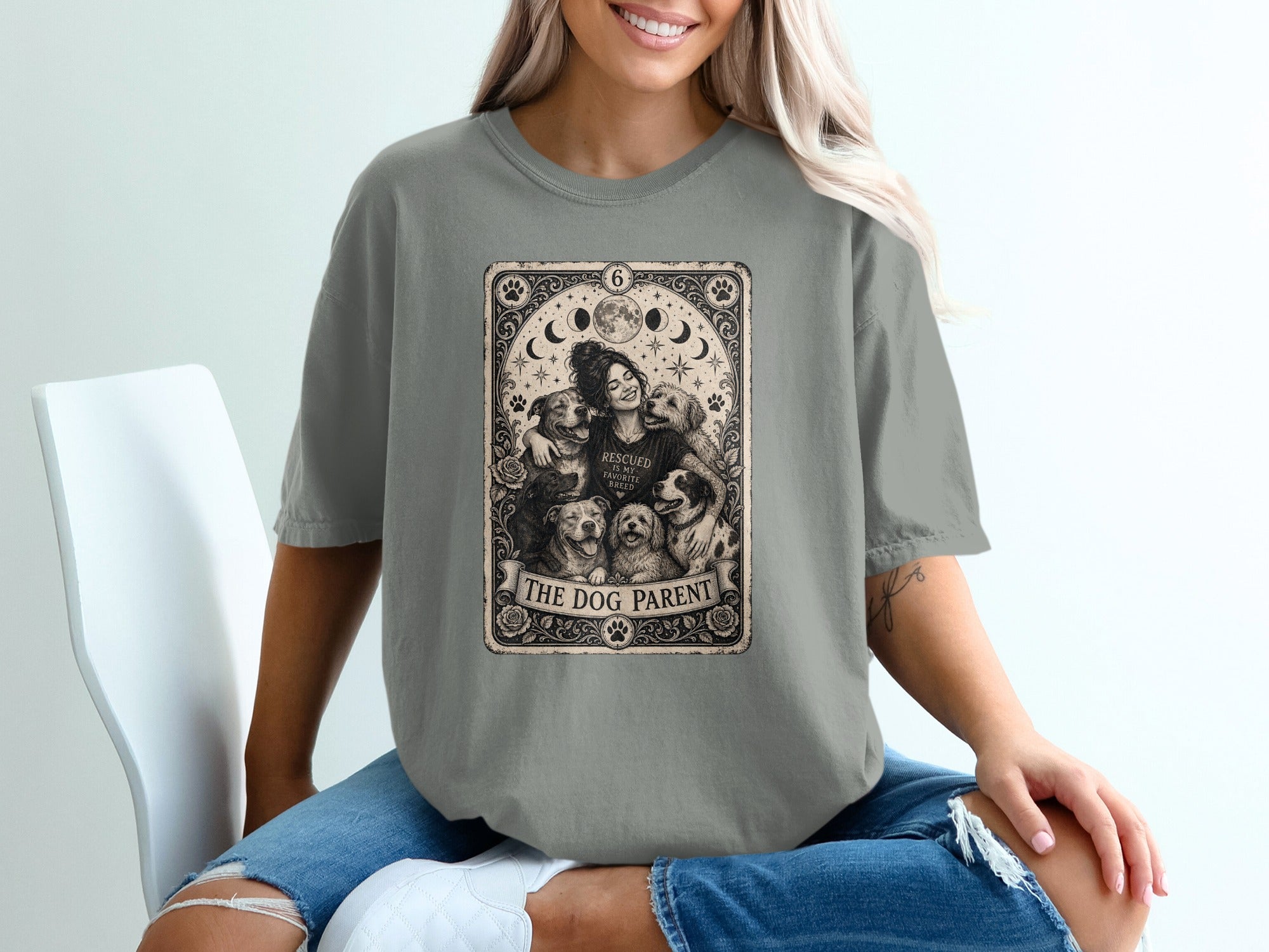 T-shirt graphic: woman embracing dogs, with text "THE DOG PARENT".