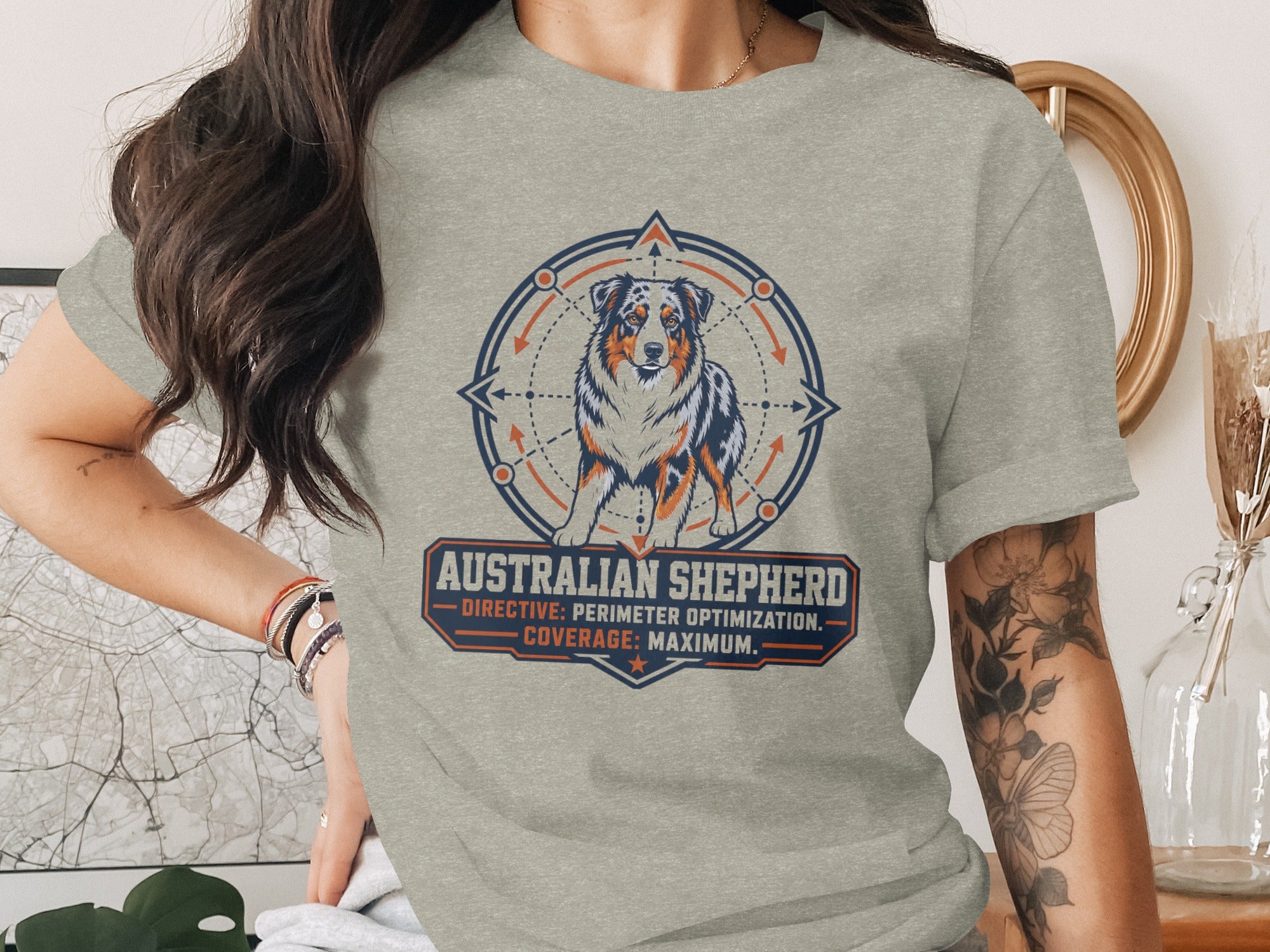 Australian Shepherd graphic on a grey t-shirt with text "DIRECTIVE: PERIMETER OPTIMIZATION. COVERAGE: MAXIMUM."