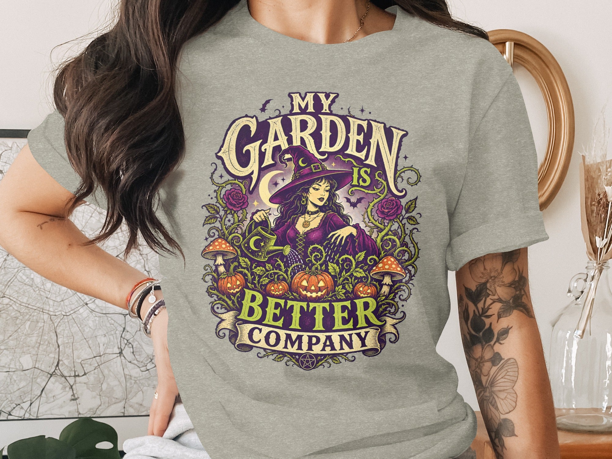 "MY GARDEN IS BETTER COMPANY" text with witch, pumpkins, mushrooms, and roses graphic.